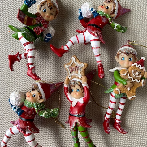 Elf hanging Christmas tree decorations